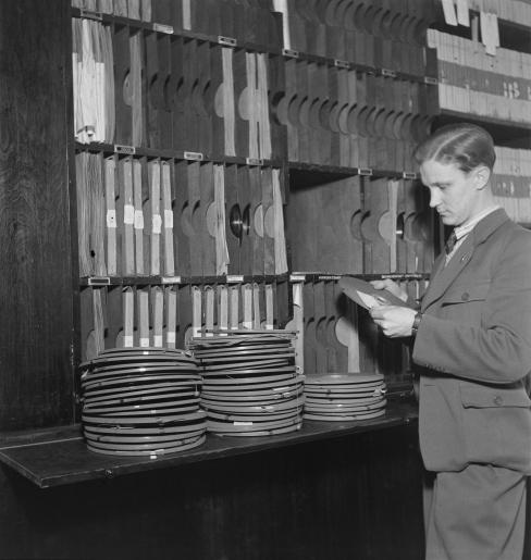 sound_archives-_an_unknown_man_handles_tapes_in_tape_library